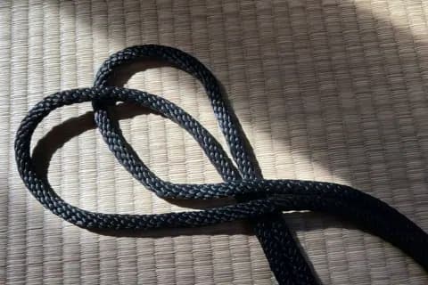 Close-up photograph of braided rope showing the twisted pattern and texture.