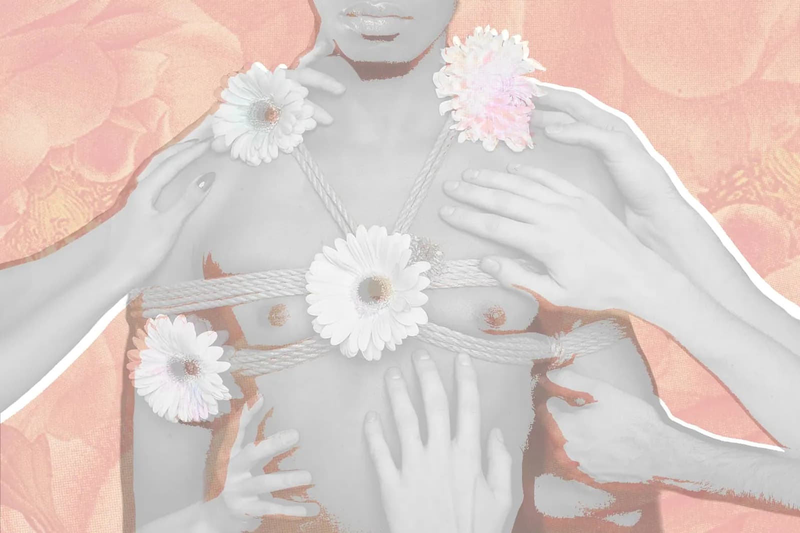 A person with a rope chest harnesses is adorned with flowers, touched by multiple pairs of hands.