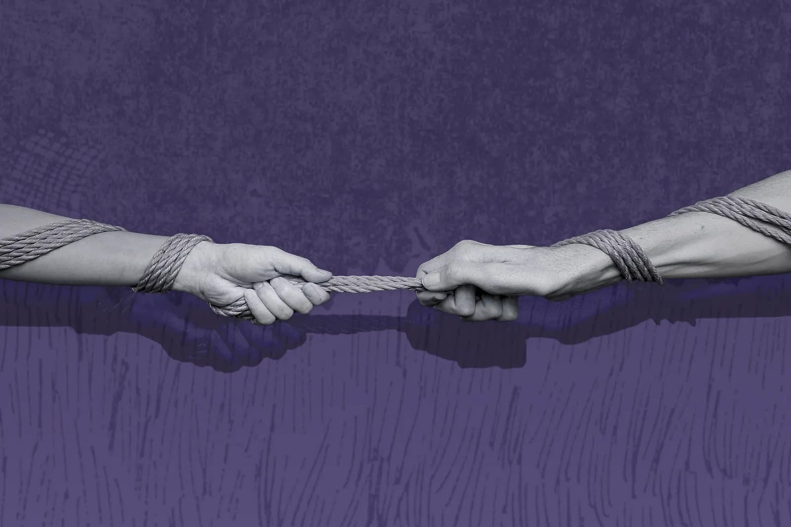 Two hands bound with rope pulling in opposite directions against a purple background