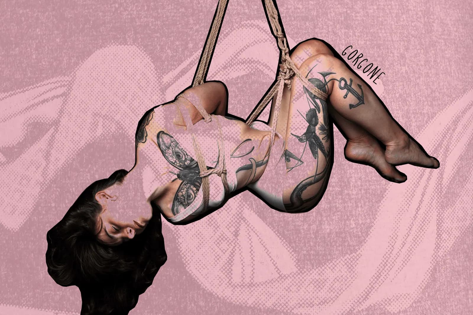 Tattooed woman suspended with a torsion in shibari ropes against pink textured background.