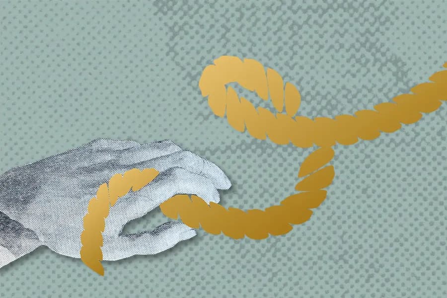 A golden shibari rope wrapped around a hand in front of a green background.