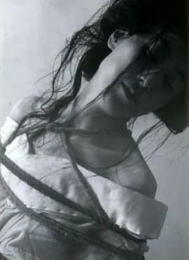 Vintage photograph of a person bound in rope bondage.
