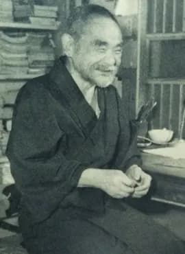 Vintage photograph showing detailed rope work on a bound person.