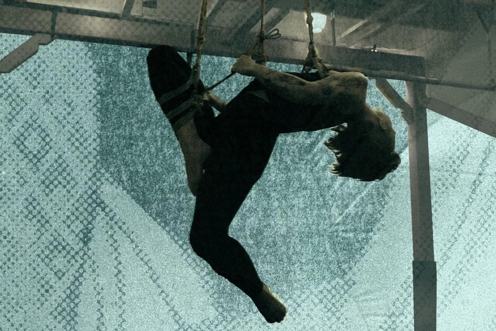 A graphic collage depicting a person in a face-up shibari suspension with a green background.