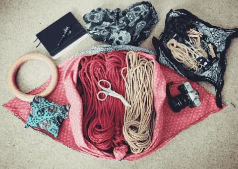 Rope and bondage gear collection displayed with multiple rope colors.
